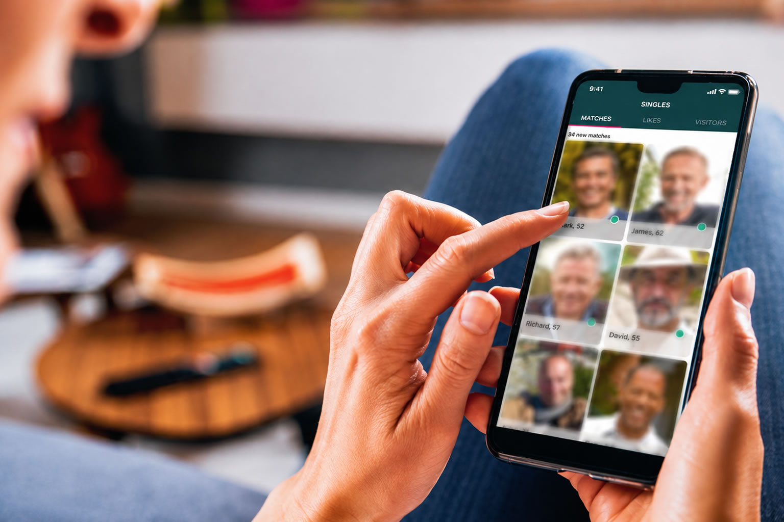 Person browsing dating profiles on a phone